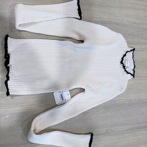 White Ribbed Turtleneck Sweater with Black Trim